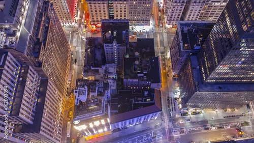Time lapse! Streets Midtown Manhattan New York City at night from 62nd floor – low angle  photo