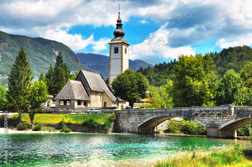 Bohinj Lake, Church of St John the Baptist with bridge. Triglav National Park, Julian Alps, Slovenia. photo