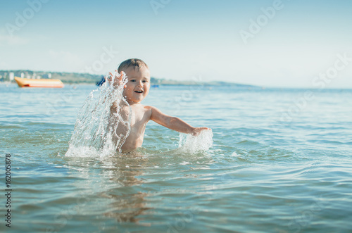 Wallpaper Mural Little boy swimming in sea Torontodigital.ca