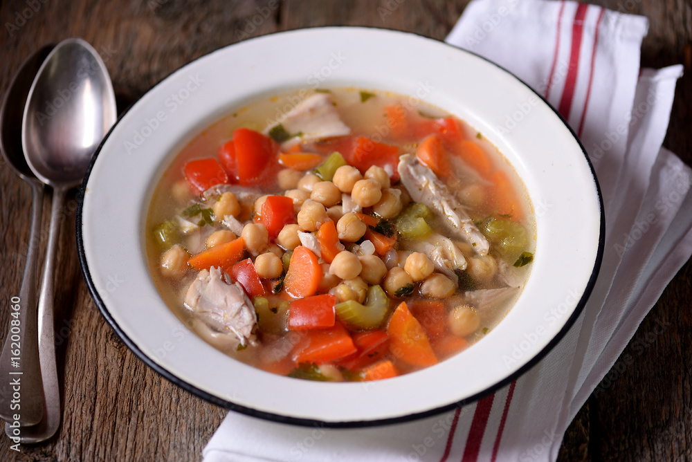 Soup with chicken, chickpeas, sweet peppers, onions, carrots, celery and parsley. Healthy food. Soup with chicken, chickpeas, sweet peppers, onions, carrots, celery and parsley. Healthy food.