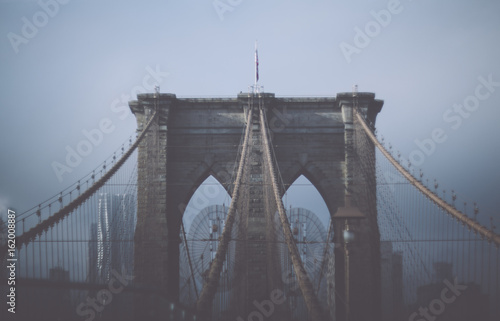 Foggy cloudy rainy day on Brooklyn Bridge. NYC 