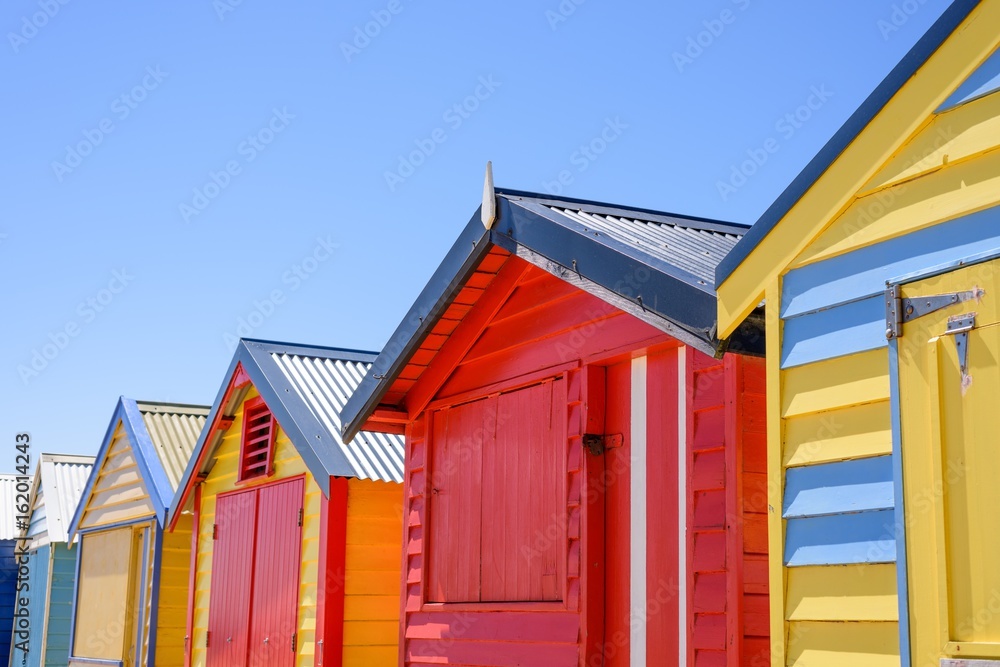Colorful bunk houses against blue sky background. Colorful bunk houses against blue sky background.