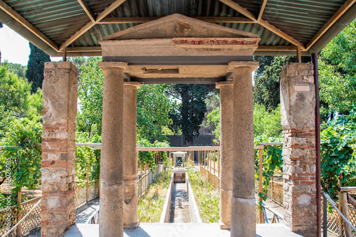 Backyard of a villa with a beautiful garden in Pompei archeological site © laudibi