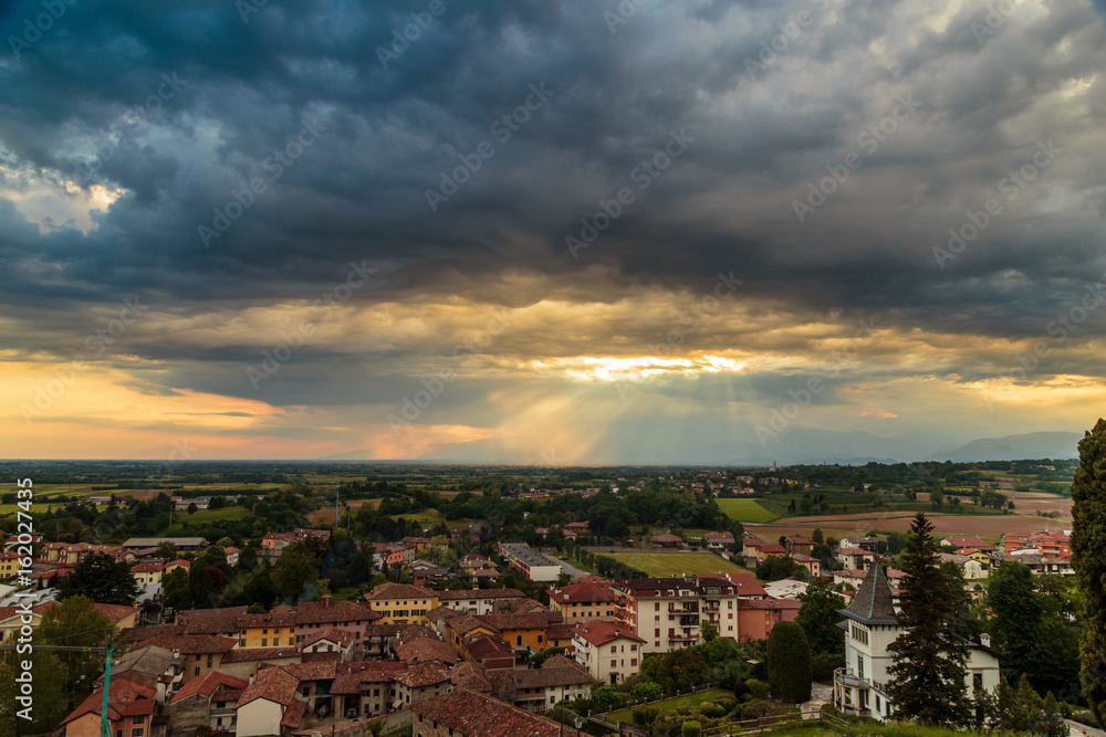 Evening storm over the medieval village