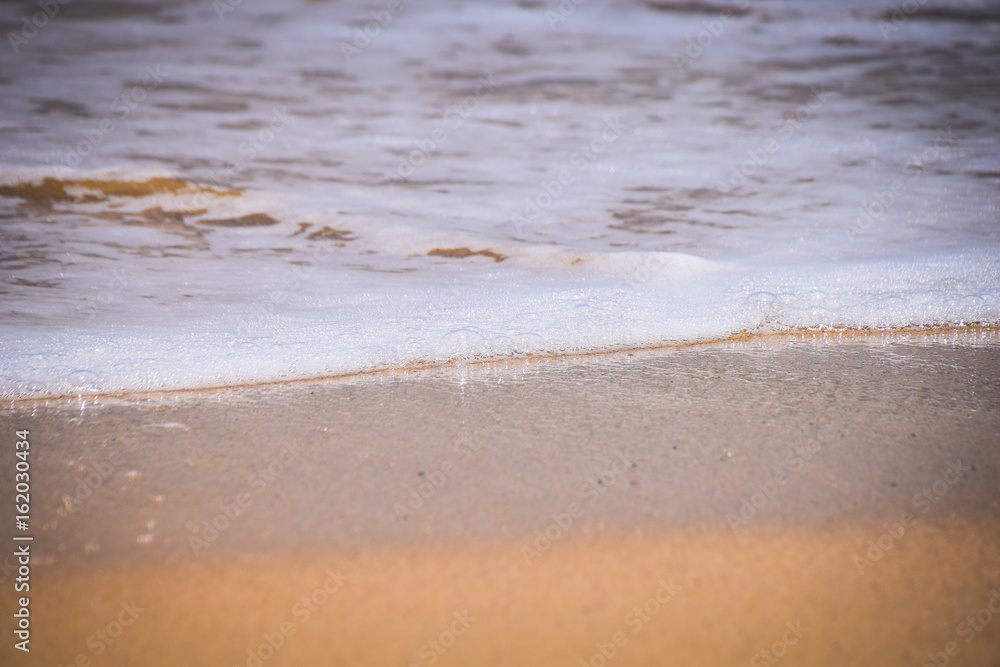 Waves breaking on a sandy beach Waves breaking on a sandy beach