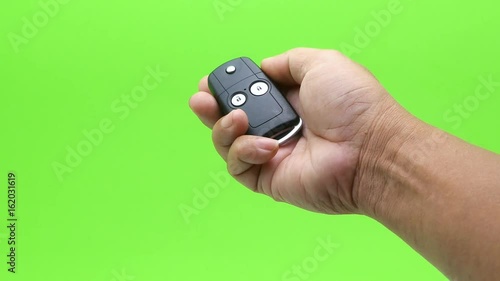 Wallpaper Mural hand presses car keys on green screen Torontodigital.ca