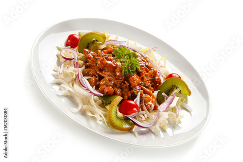 Rice noodles with meat, sauce and vegetables 