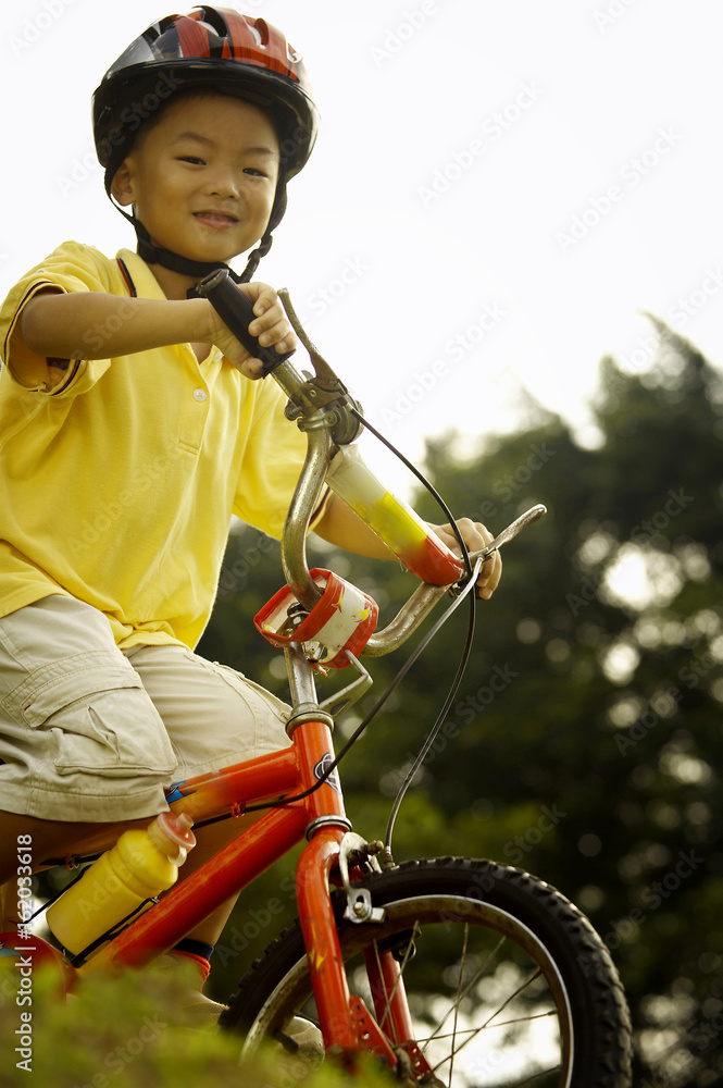 Naklejka premium Boy riding bicycle