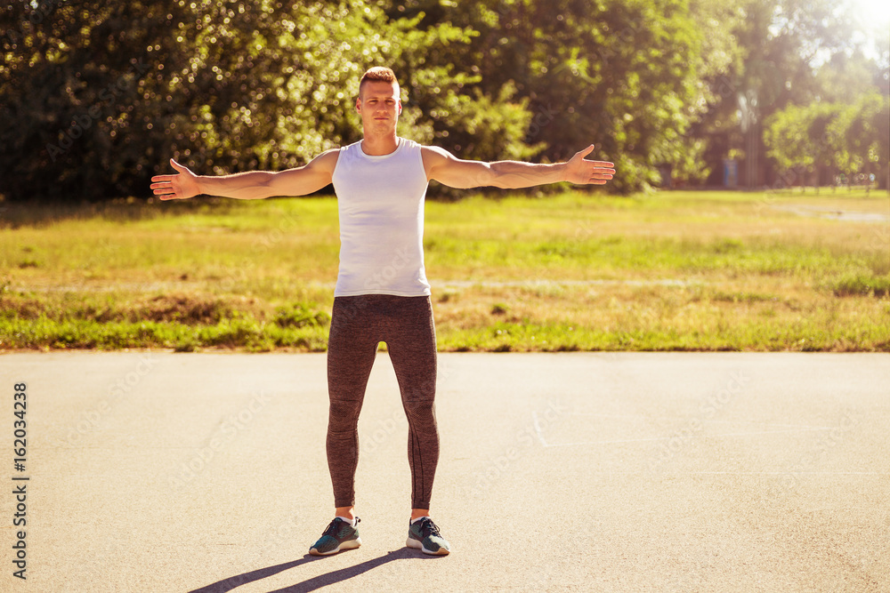 Young man exercising outdoor. Young man exercising outdoor.