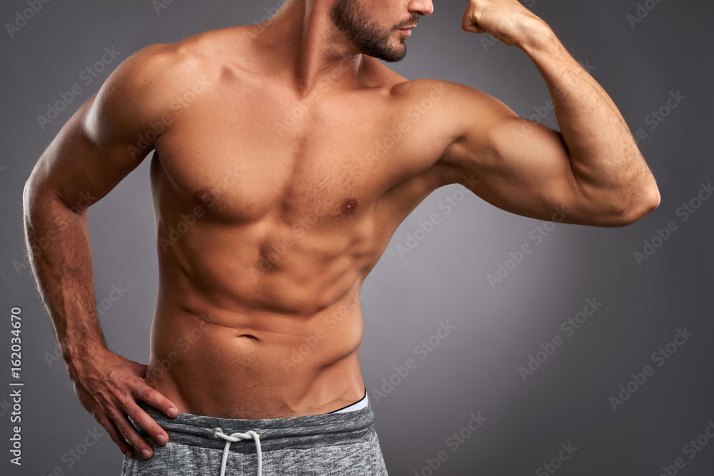 Fototapeta premium Body of a young sportsman 