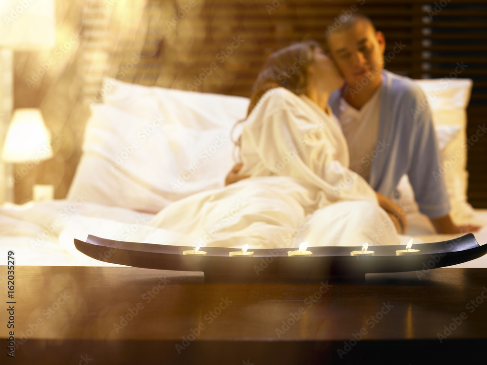 Man and woman embracing in bed Man and woman embracing in bed