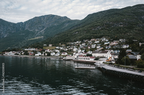 Sailing through Sognefjord, Norway. Picturesque small village on the way to Flam © Taras