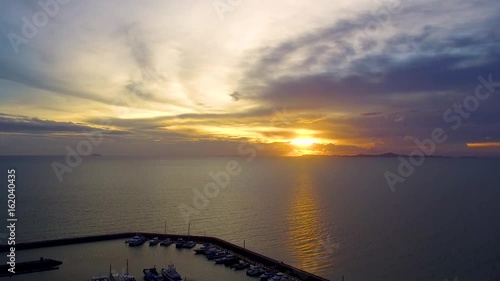 Aerial shot and yatch club with the sea sunset sky view photo