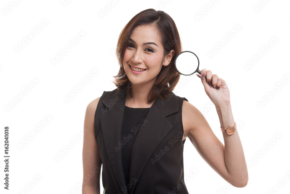 Young Asian woman with a magnifying glass. Young Asian woman with a magnifying glass.