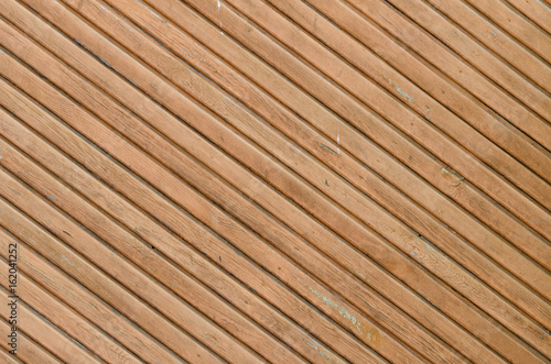 Diagonally disposed brown vintage planks. Vertically arranged. Texture. Background