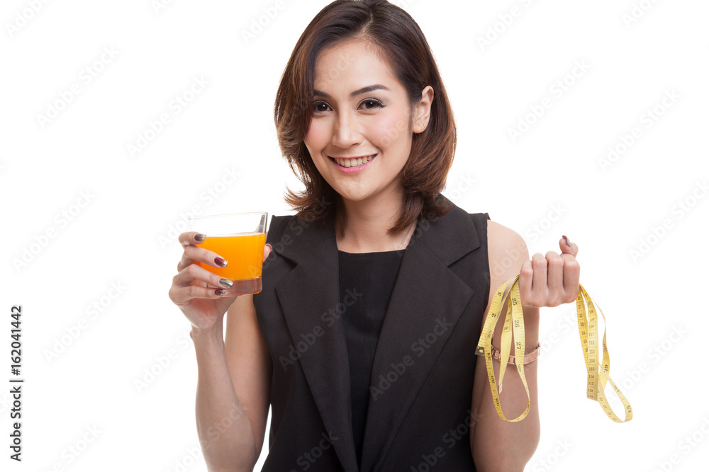 Asian woman drink orange juice hold measuring tape. Asian woman drink orange juice hold measuring tape.