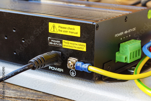 Bild auf Leinwand PoE ethernet switch with ground cable connected
