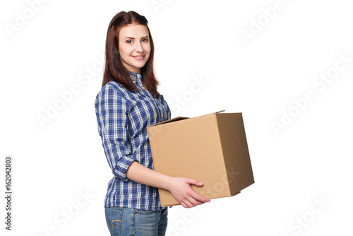 Delivery, relocation and unpacking. Smiling young woman holding cardboard box isolated on white background © paffy