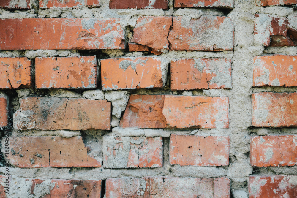 Obraz premium red brick wall texture grunge background with vignetted corners, may use to interior design