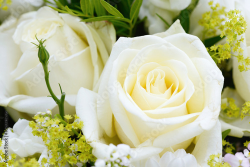 bunch of flowers with white roses