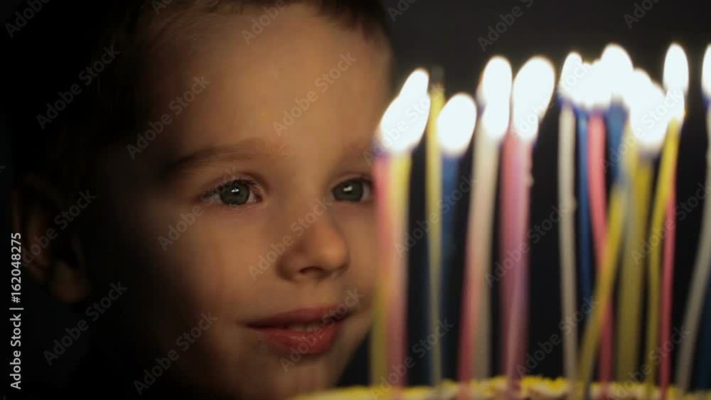 Boy makes a wish on birthday Boy makes a wish on birthday