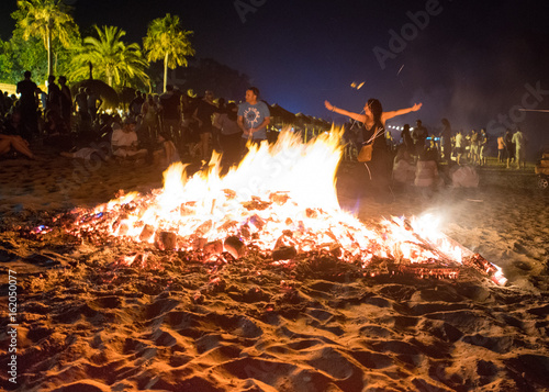 MARBELLA, SPAIN - JUNE 23, 2017: Celebrating San Juan on the beach in Marbella, Costa del Sol, Spain. Bonfires are lit and Flaming Lanterns released to mark the beginning of Summer