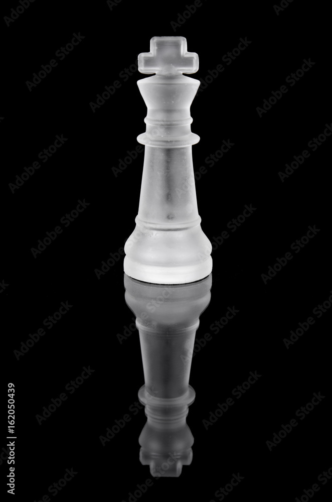 Glass chess king on black isolated background. Glass chess king on black isolated background.