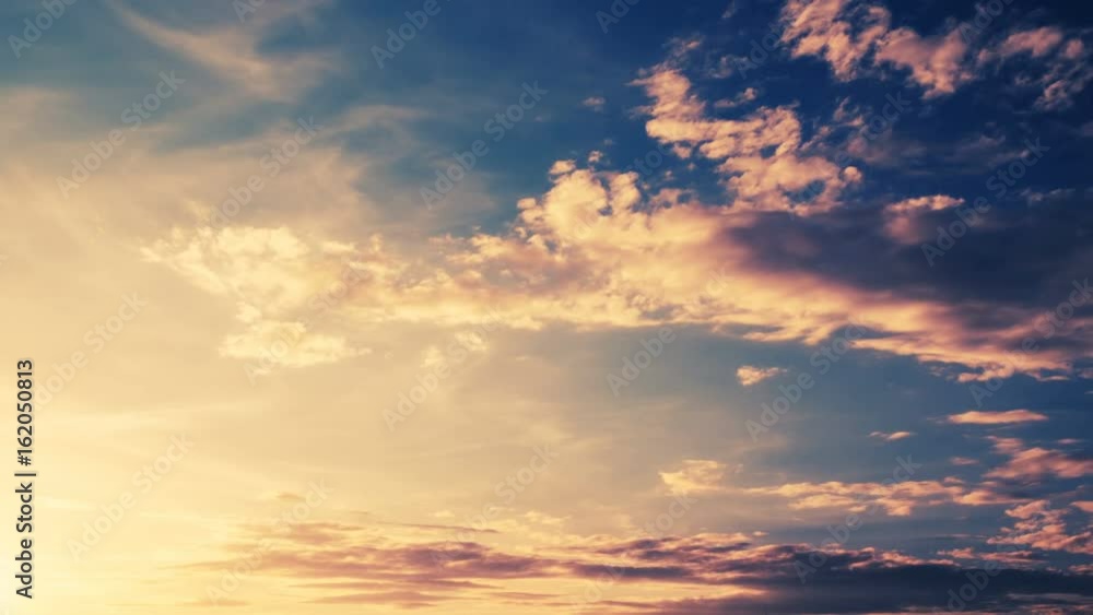 Clouds Running Across the rapidly Darkening Sky at Sunset. Clouds Running Across the rapidly Darkening Sky at Sunset.