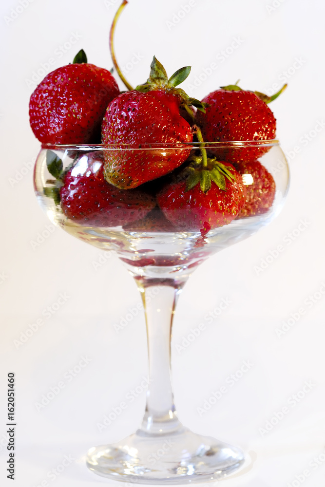 srawberries and glass srawberries and glass