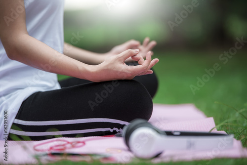 close up image hands of young woman doing yoga