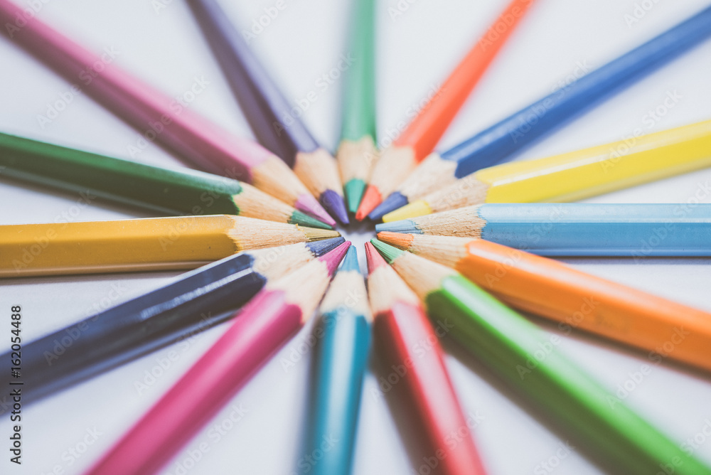 Colorful pencils in arrange in color wheel colors, warm tone