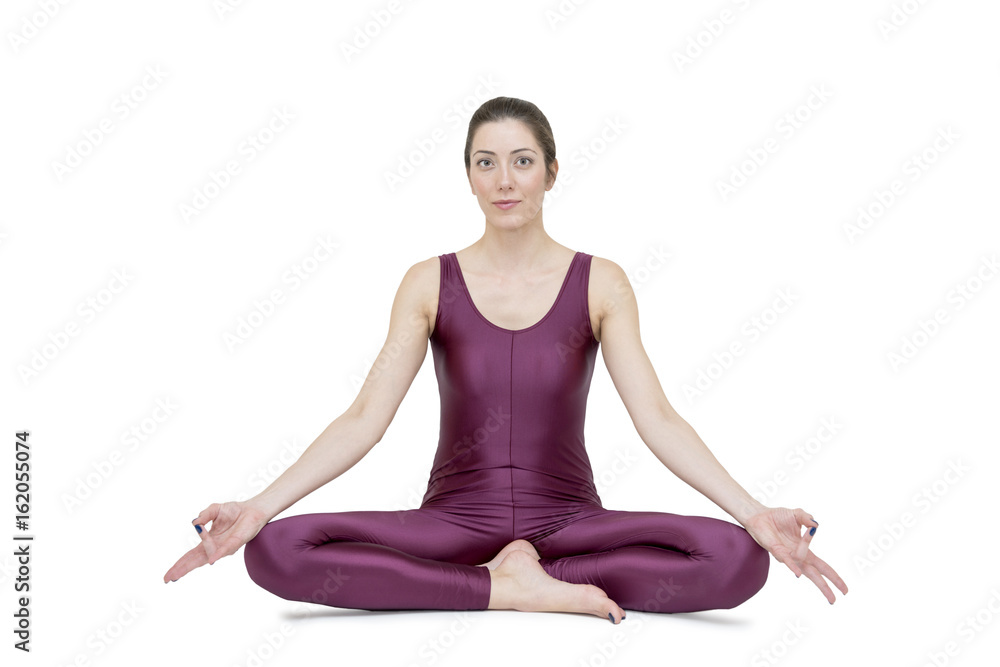Woman practicing yoga in Muktasana pose Woman practicing yoga in Muktasana pose