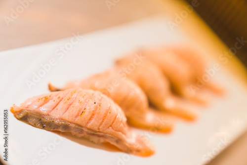 Flame-seared salmon sushi, Japanese food delicious menu, Asian cuisine or buffet restaurant concept