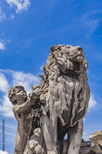 Sculpture Lion conduit par un enfant at Pont Alexandre III in Paris