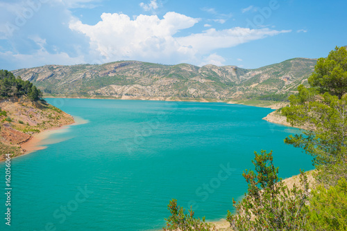 Fototapeta Naklejka Na Ścianę i Meble -  Reservoir dammed in a vally in summer