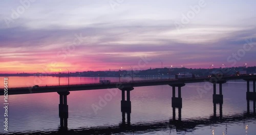 Wallpaper Mural aerial view picturesque pink sunset over river and bridge with moving cars Torontodigital.ca