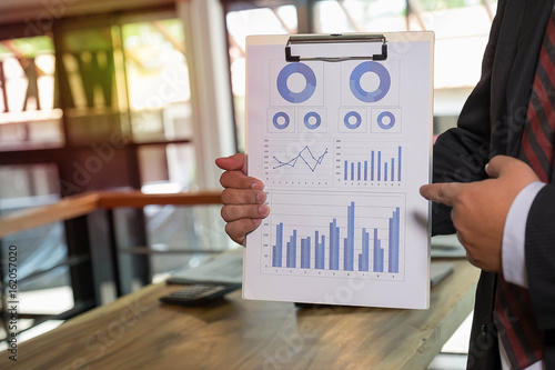 Holding report paper with in the room