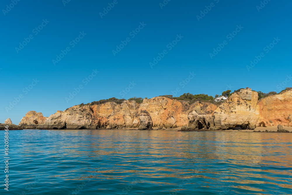 Scenic golden cliffs near Alvor, Portimao, Algarve