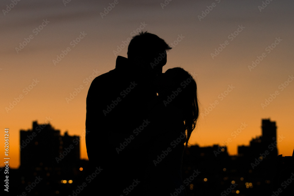Silhouette of Couple Kissing 
