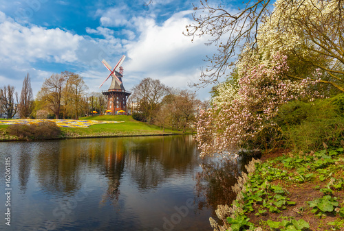 Popular city park Wallanlagen with Am Wall Windmill and river in Bremen, Germany