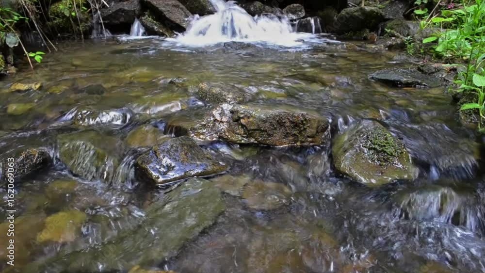 Waterfall in the spring mountain forest Waterfall in the spring mountain forest
