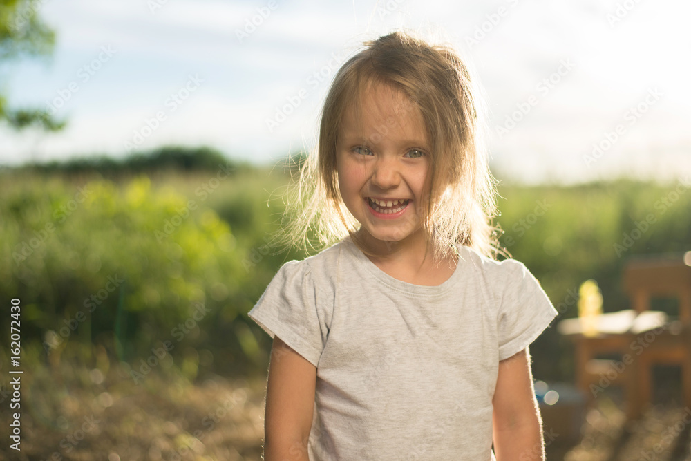 closeup of laughing kid face on nature closeup of laughing kid face on nature