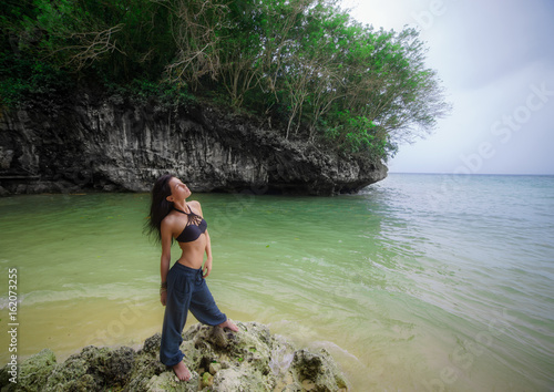 Brunette girl on the Bali beach photo