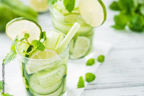 Refreshing drink with cucumber, lime, mint. Close up