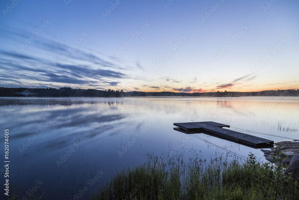 Obraz premium Beautiful midsummer night in Finland next to lake