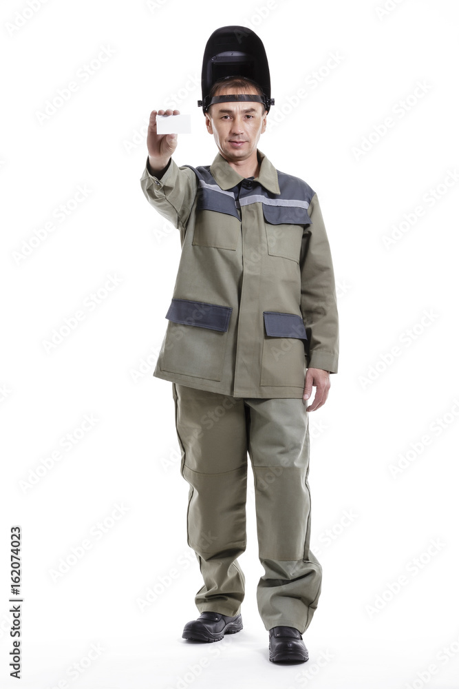 Positive welder with a white card in his hand Positive welder with a white card in his hand
