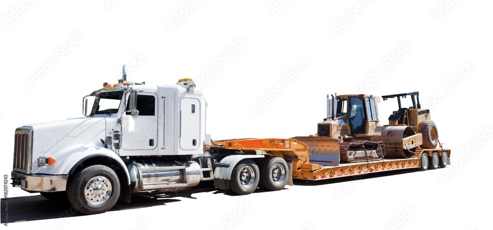 Flatbed semi hauling bulldozer. Isolated. Flatbed semi hauling bulldozer. Isolated.