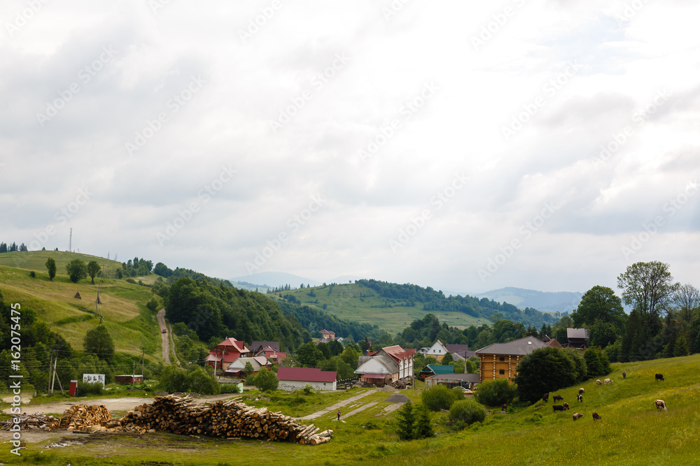 Small settlement in the mountain. Houses,outbuildings and fields. Small settlement in the mountain. Houses,outbuildings and fields.