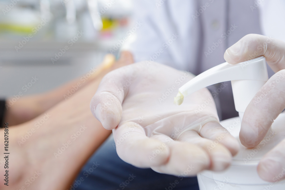 surgeon using handwash with gloves in washroom surgeon using handwash with gloves in washroom
