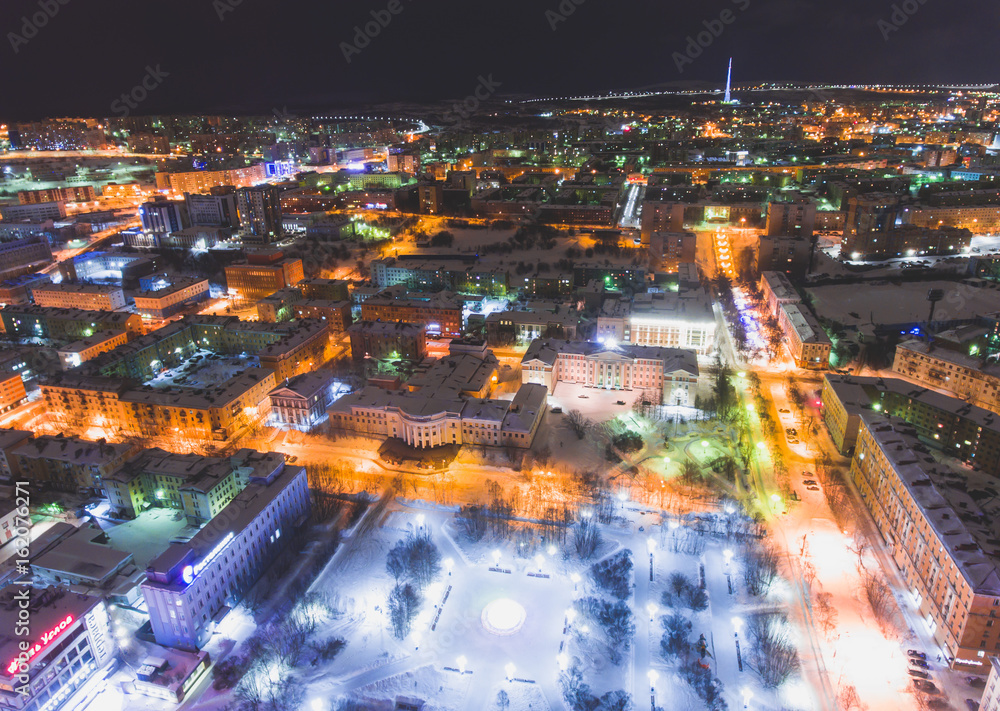 Naklejka premium Beautiful aerial air winter vibrant view of Murmansk, Russia, a port city and the administrative center of Murmansk Oblast, Kola peninsula, Kola Bay